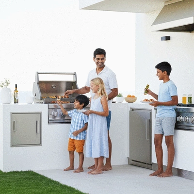 Family enjoying barbecue in outdoor kitchen