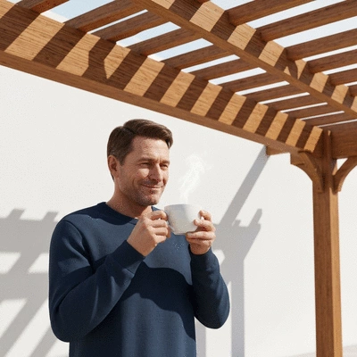 User enjoying a coffee under a pergola