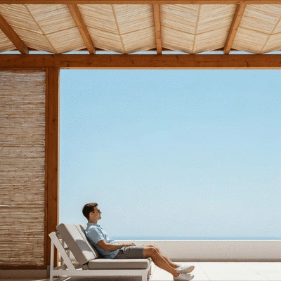 User enjoying an outdoor space shaded by a stylish structure